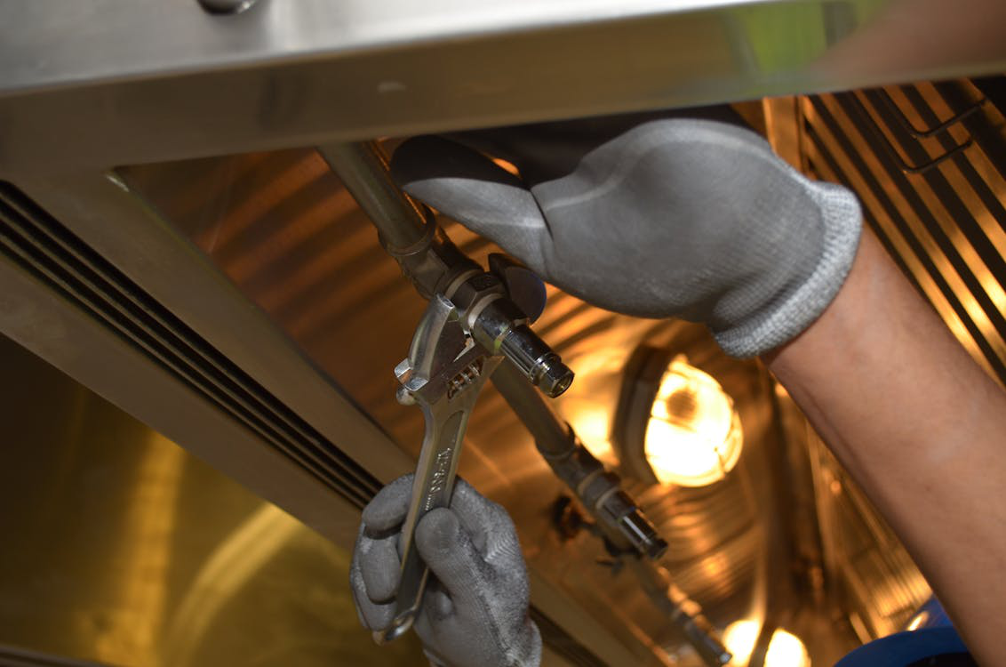 a plumber fixing a plumbing pipe.