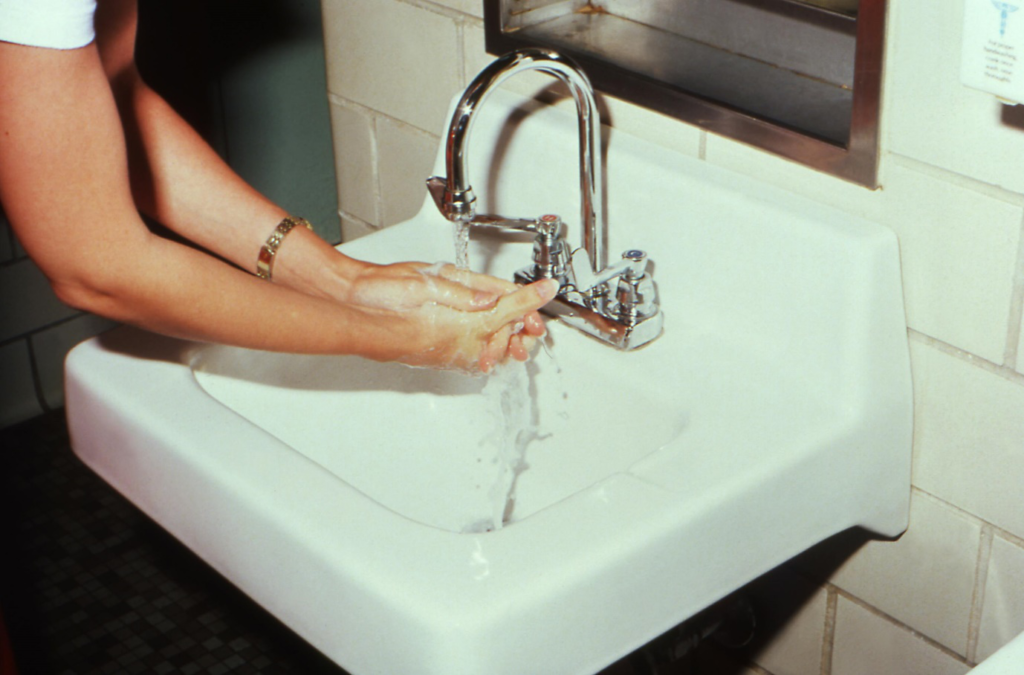 A person washing hands